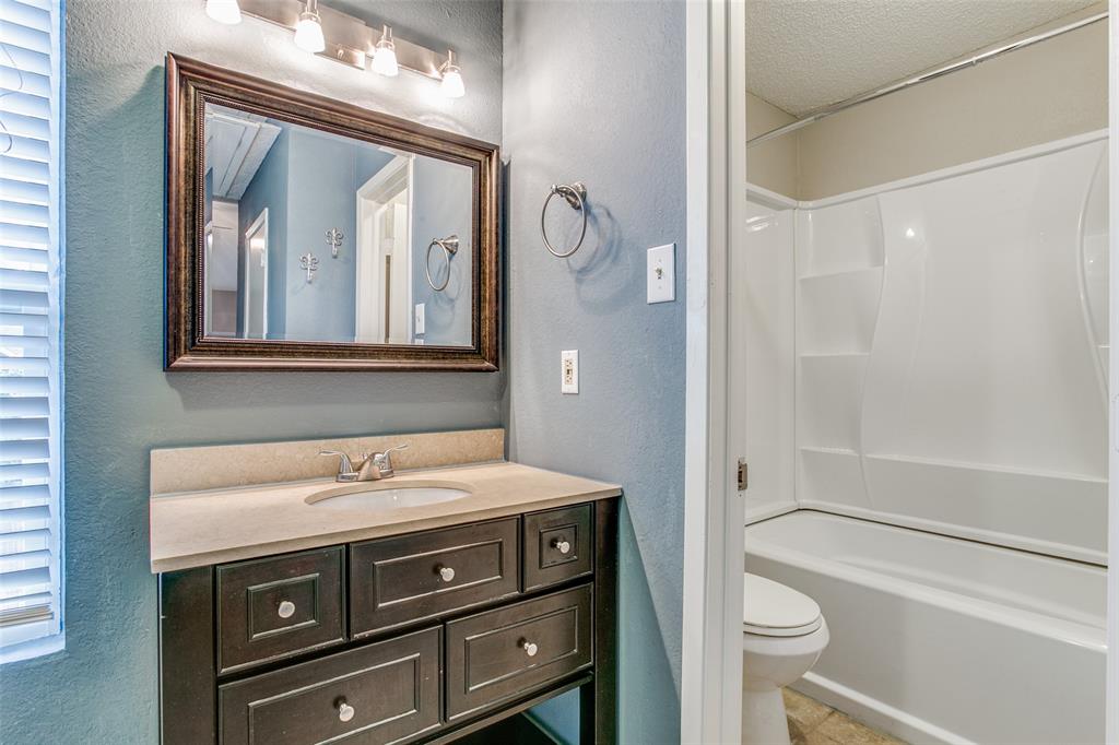 12 Abbey Road Euless, TX 76039 - Photo 11 of 12 Full bath with a vanity, and shower / washtub combination