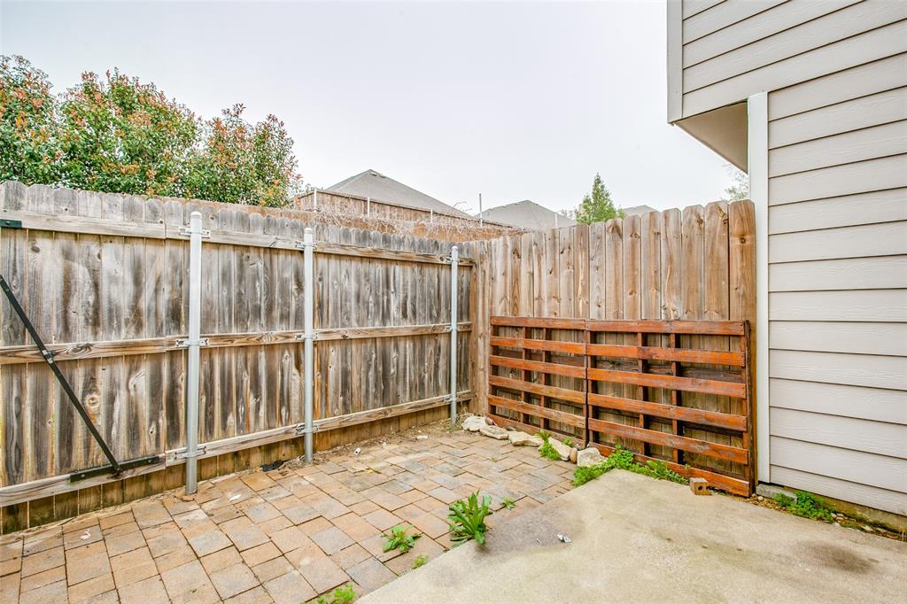 12 Abbey Road Euless, TX 76039 - Photo 12 of 12 Fenced backyard featuring a patio