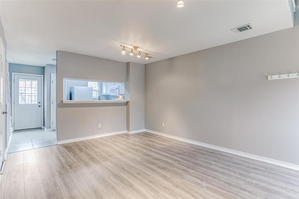 12 Abbey Road Euless, TX 76039 - Photo 4 of 12 dining room featuring light wood-style floors and baseboards