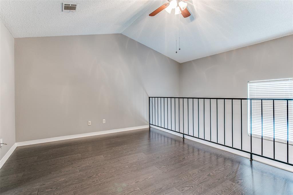 12 Abbey Road Euless, TX 76039 - Photo 8 of 12 Loft bedroom with ceiling fan, dark wood finished floors