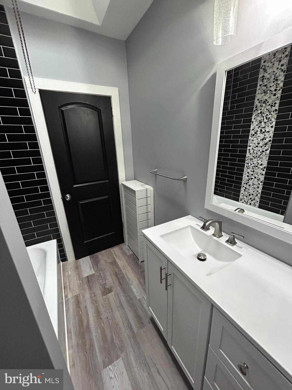 1116 Sanger Street Philadelphia, PA 19124 - Photo 18 of 47 a bathroom with a sink and a mirror