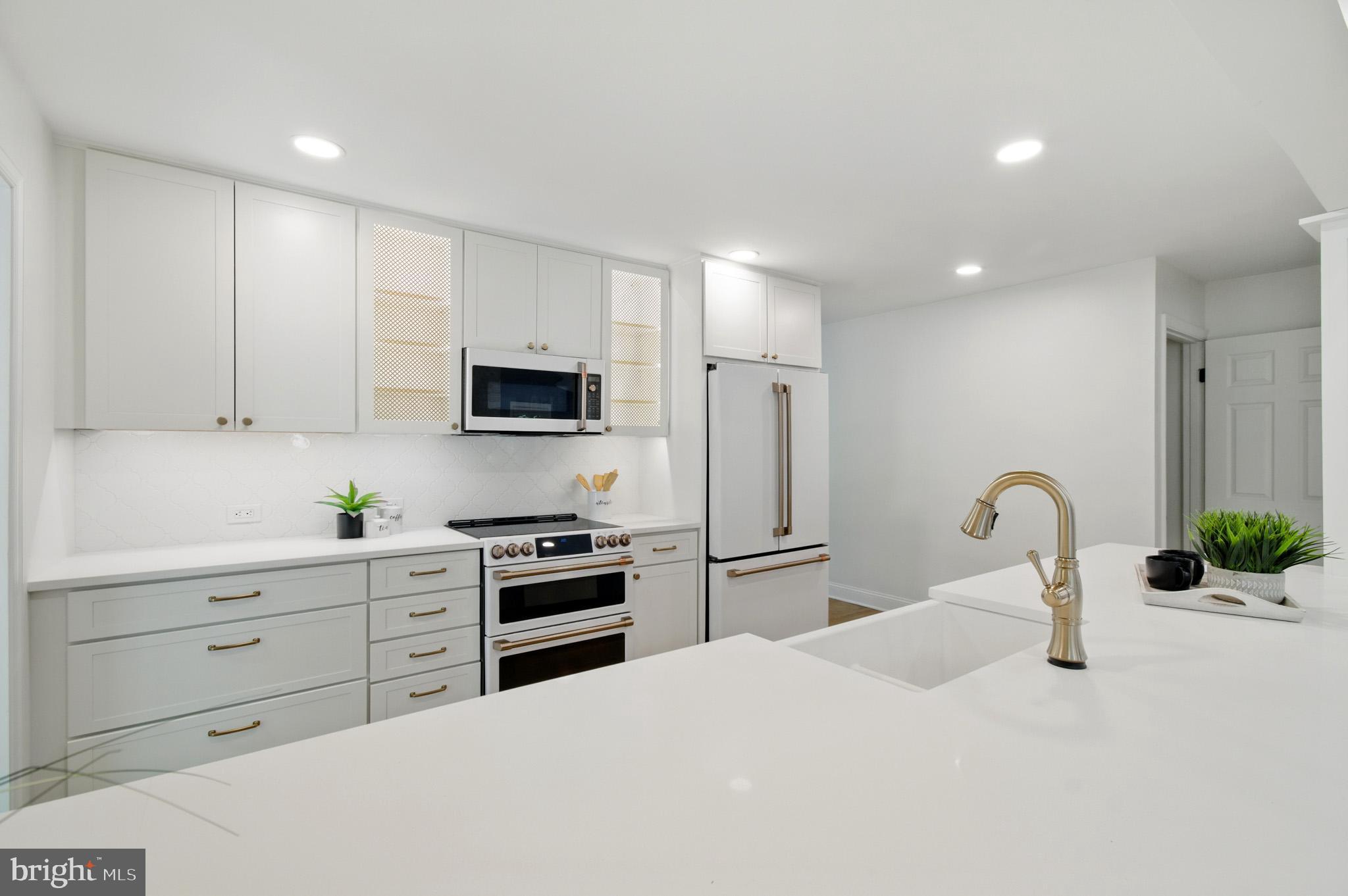 3633 Valley Road Ellicott City, MD 21042 - Photo 17 of 72 a kitchen with sink a stove and refrigerator