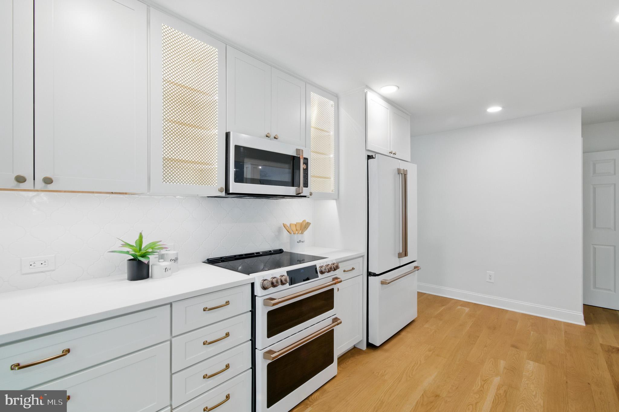 3633 Valley Road Ellicott City, MD 21042 - Photo 22 of 72 a kitchen with stainless steel appliances a refrigerator sink and microwave