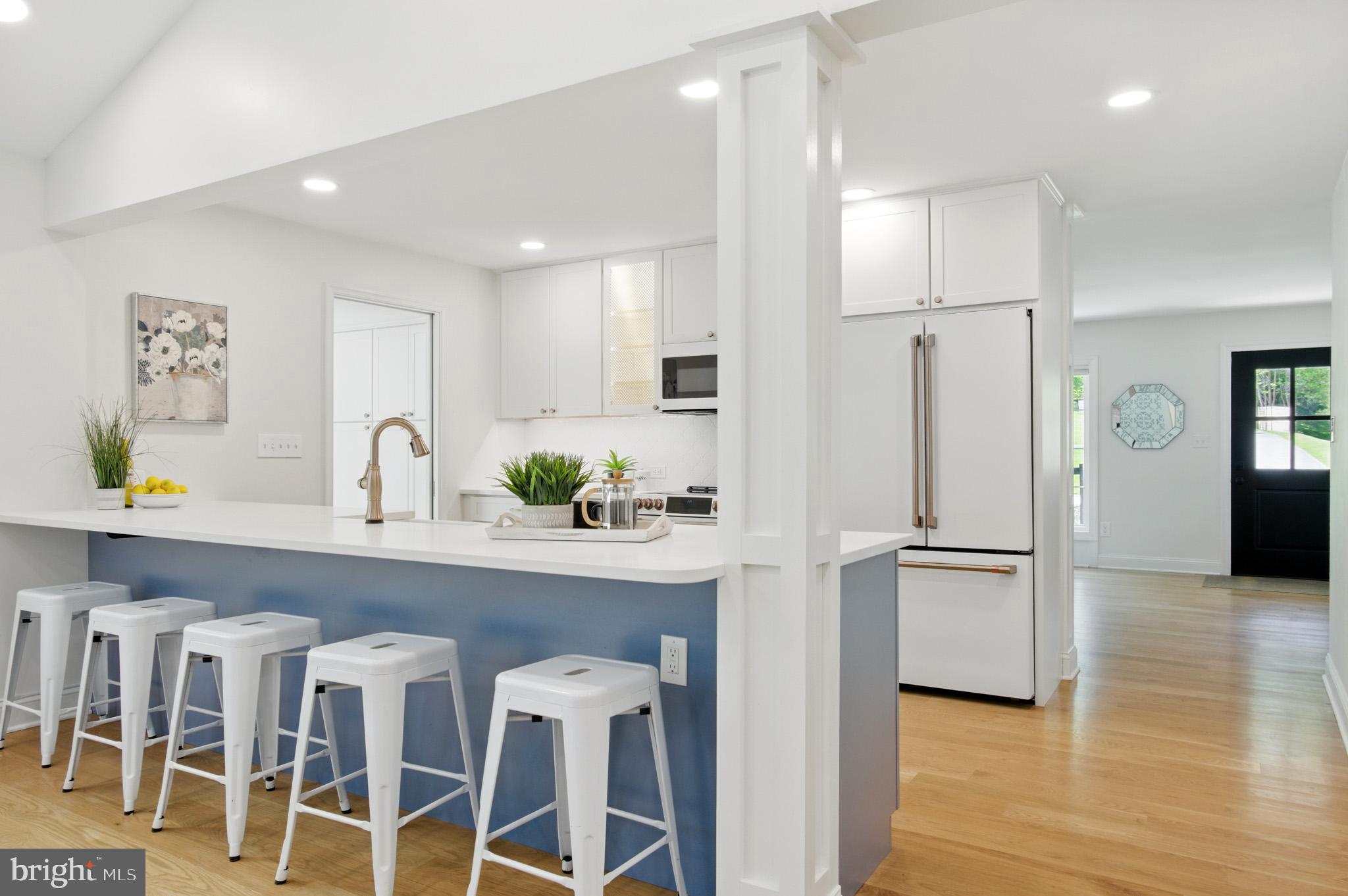 3633 Valley Road Ellicott City, MD 21042 - Photo 24 of 72 a kitchen with white cabinets and stainless steel appliances