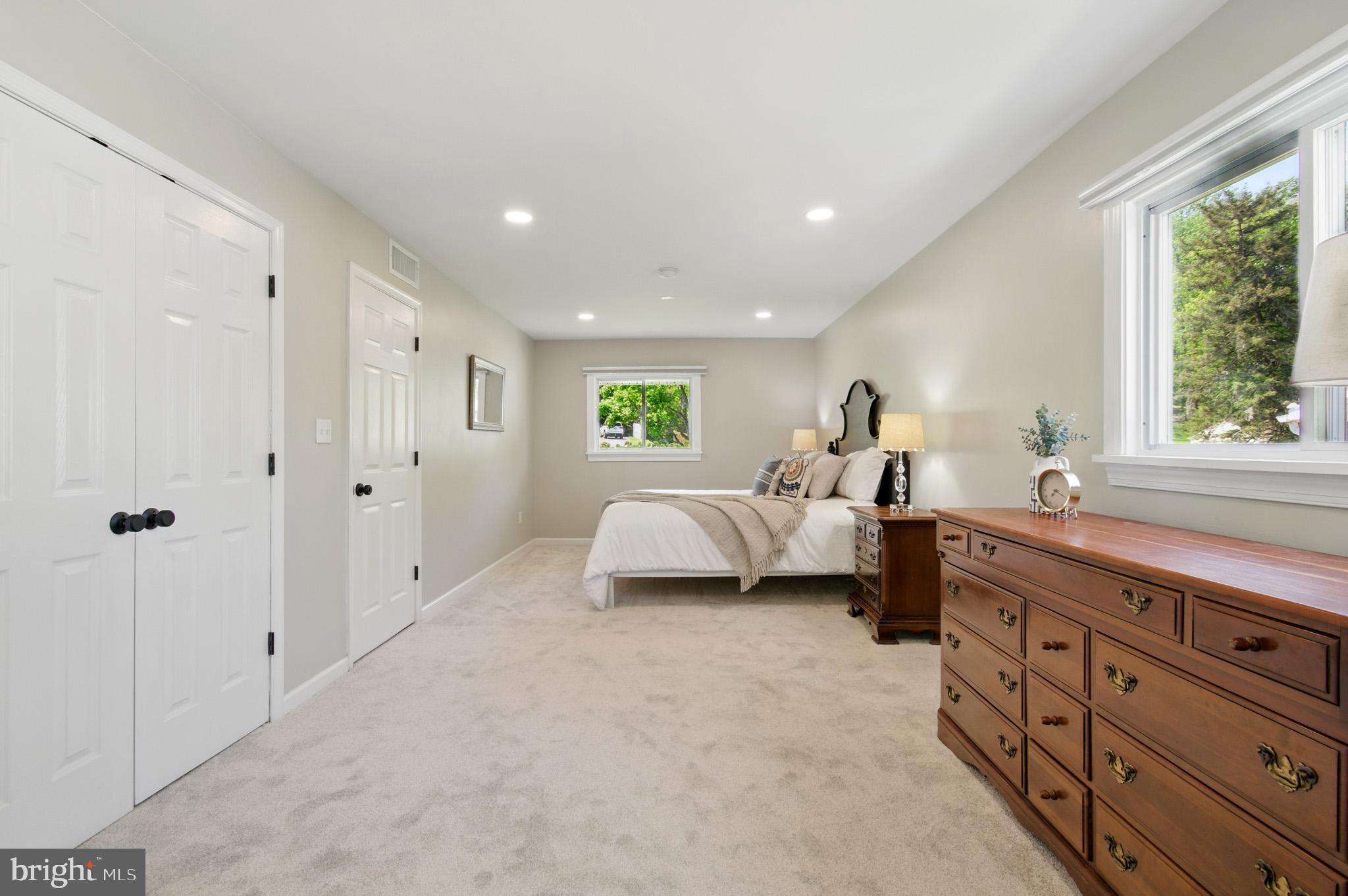 3633 Valley Road Ellicott City, MD 21042 - Photo 35 of 72 a spacious bedroom with a large bed and a dresser