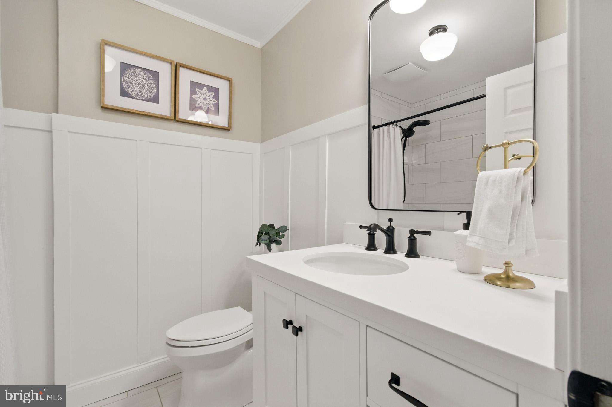 3633 Valley Road Ellicott City, MD 21042 - Photo 41 of 72 a bathroom with a sink mirror vanity and toilet