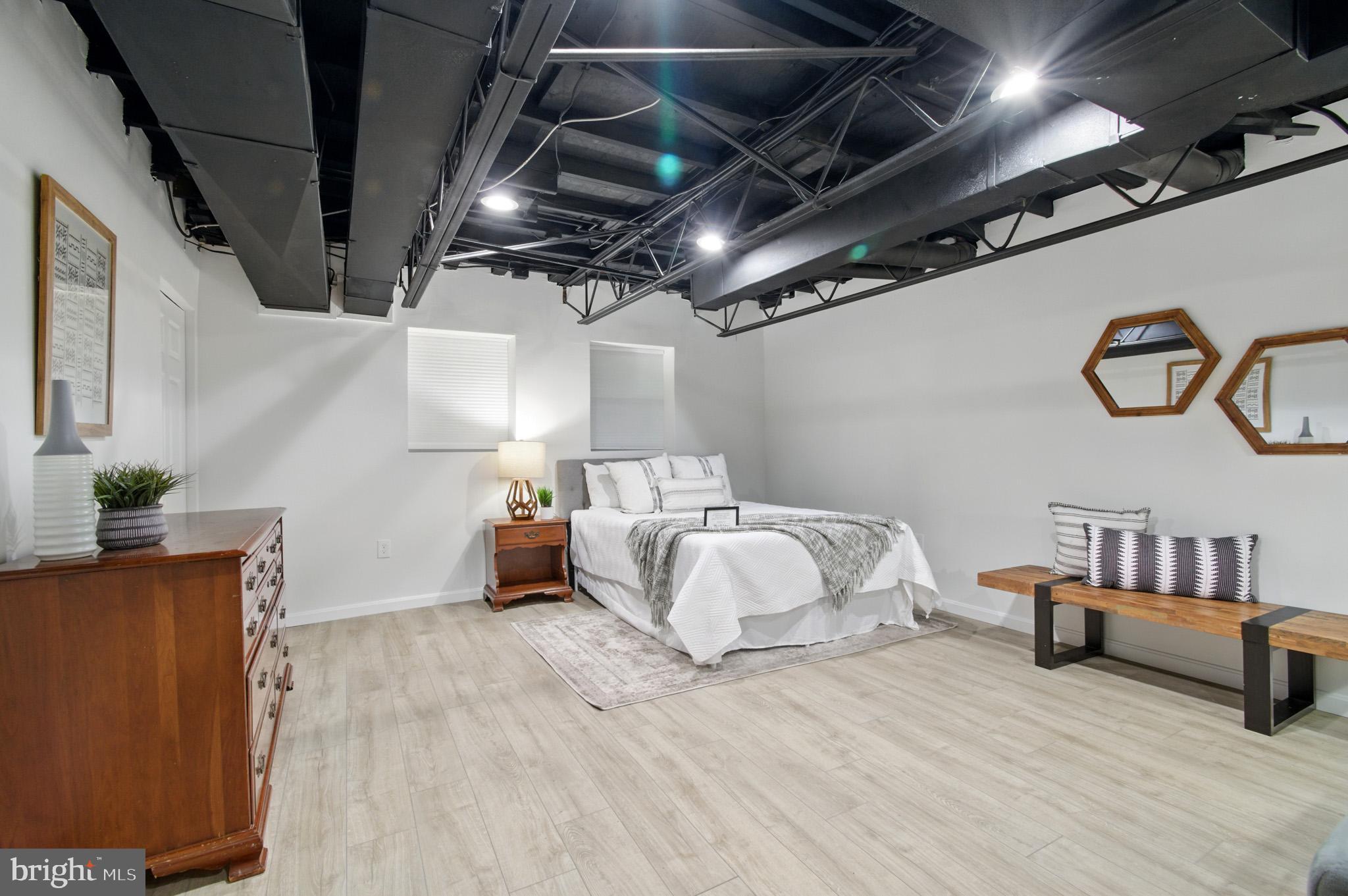 3633 Valley Road Ellicott City, MD 21042 - Photo 44 of 72 a spacious bedroom with a bed and a couch