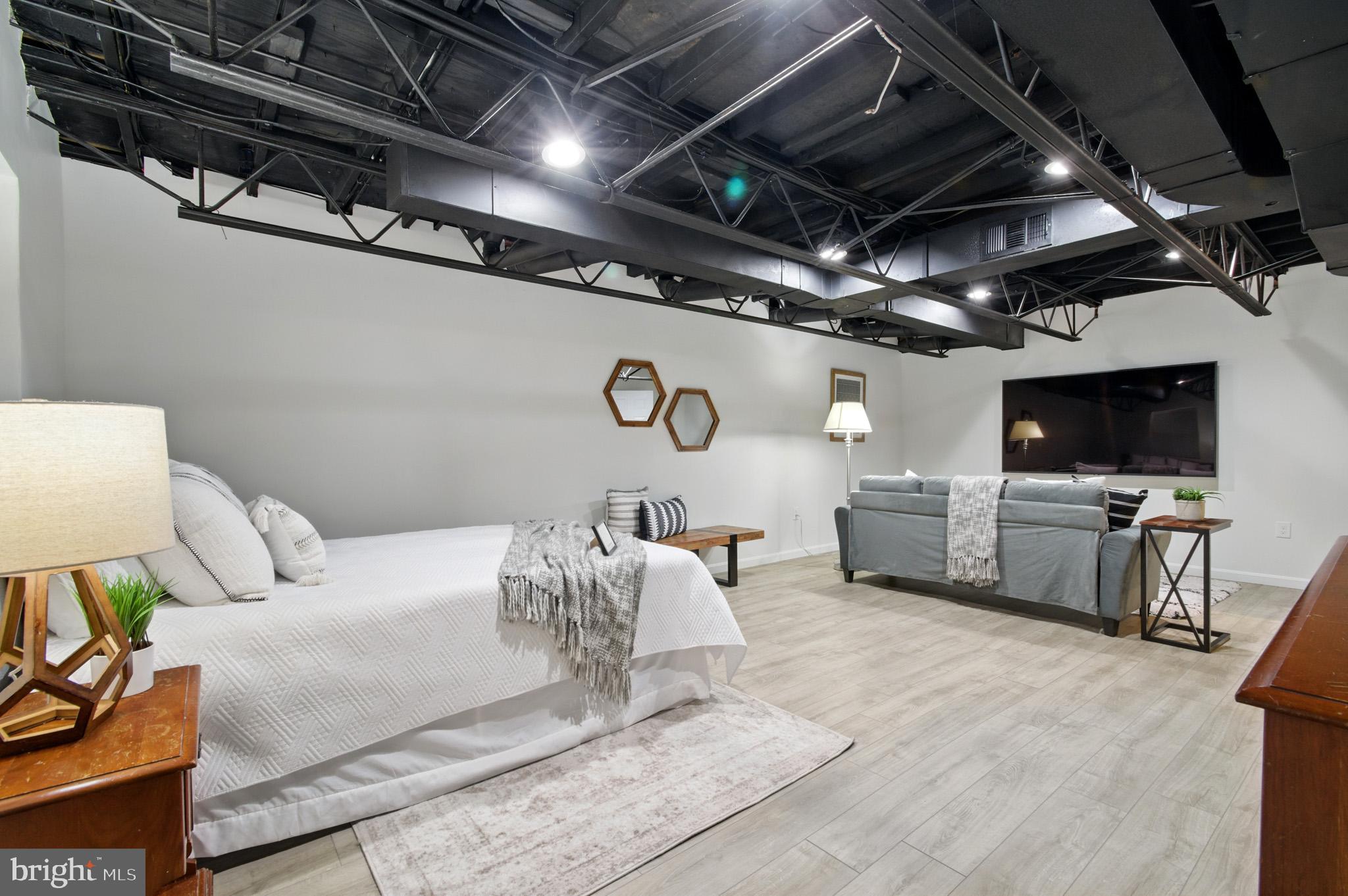 3633 Valley Road Ellicott City, MD 21042 - Photo 46 of 72 a living room with furniture and a flat screen tv