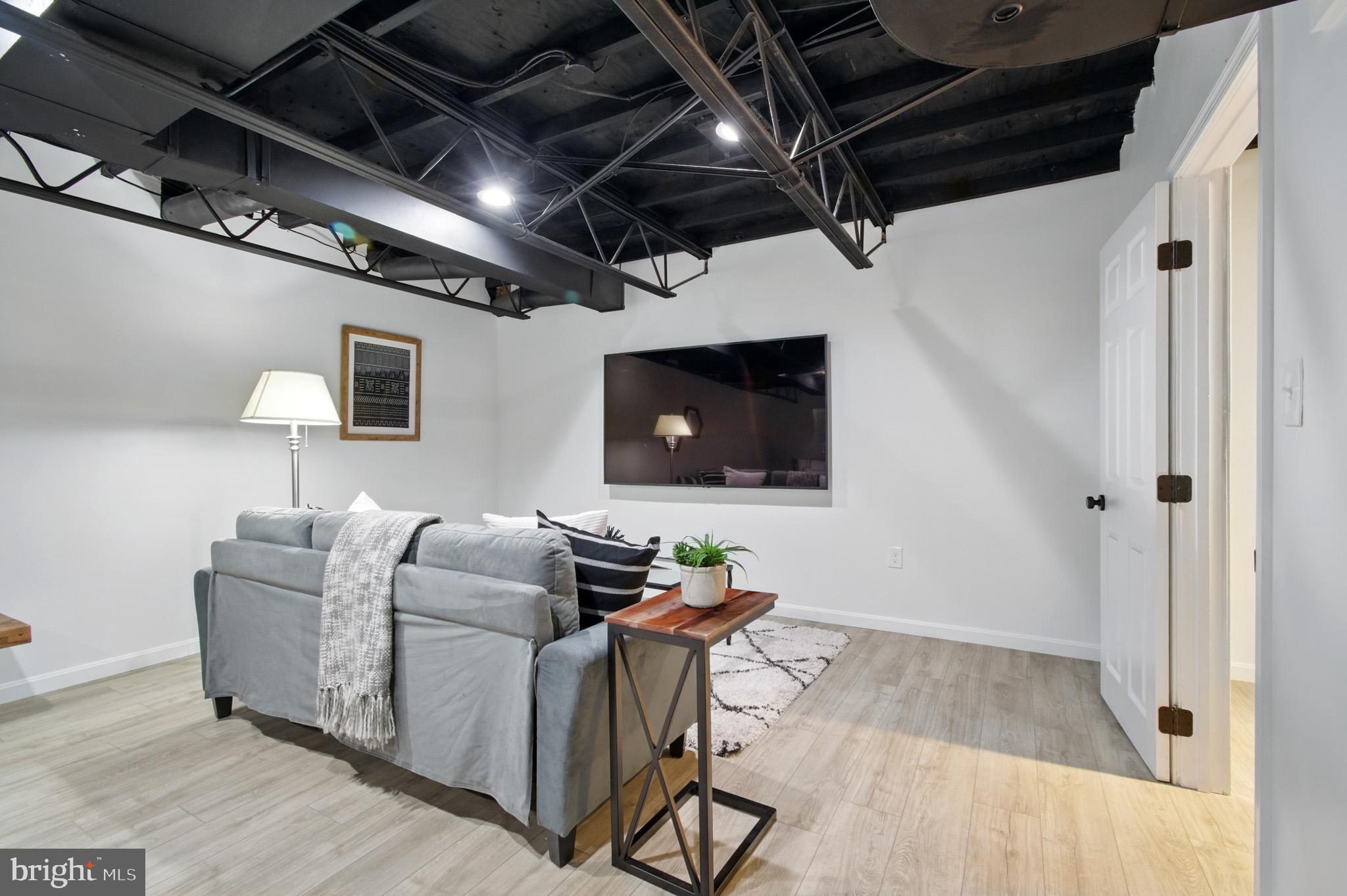 3633 Valley Road Ellicott City, MD 21042 - Photo 47 of 72 a living room with furniture and a flat screen tv