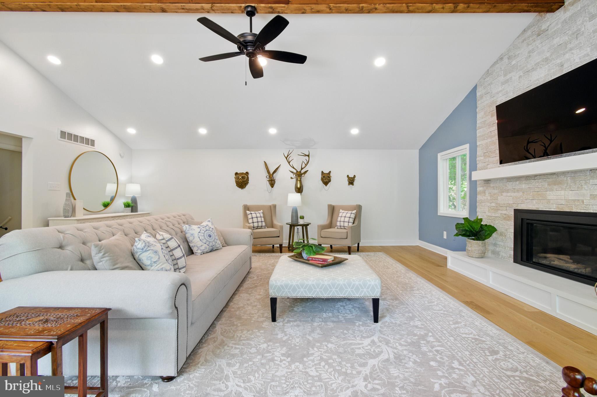 3633 Valley Road Ellicott City, MD 21042 - Photo 10 of 72 a living room with furniture fireplace and flat screen tv