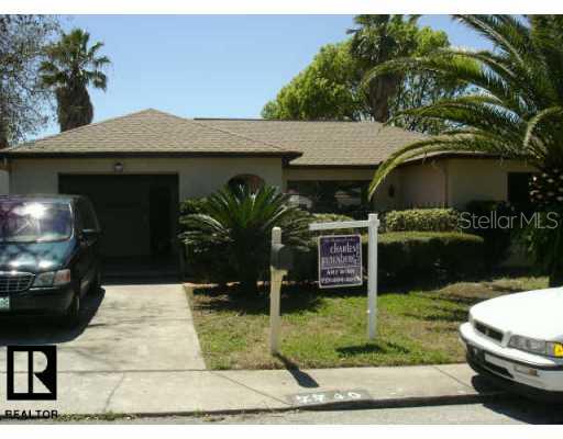 7740 Turnbridge Drive Port Richey, FL 34668 - Photo 1 of 1 a front view of house with yard