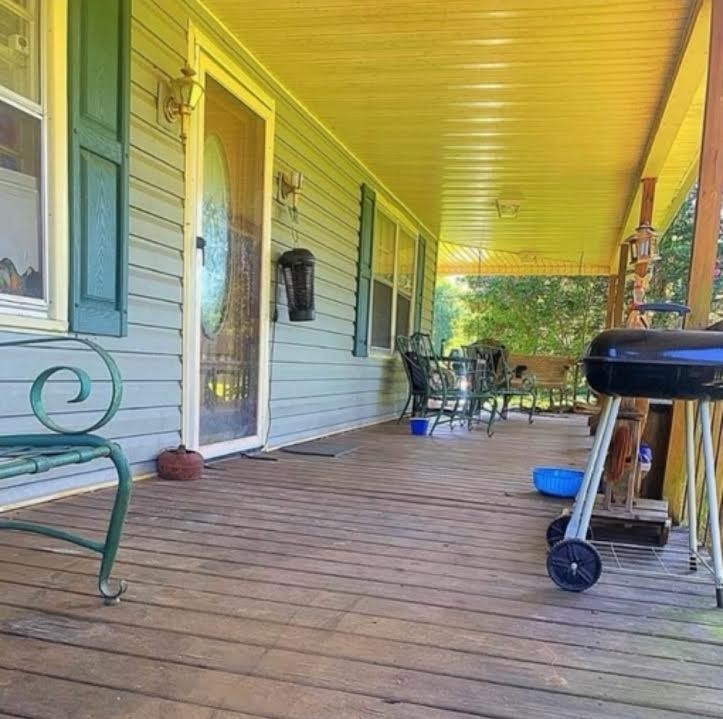 2058 Jefferson Road Smithville, TN 37166 - Photo 3 of 10 a view of a hall with wooden floor and iron fence