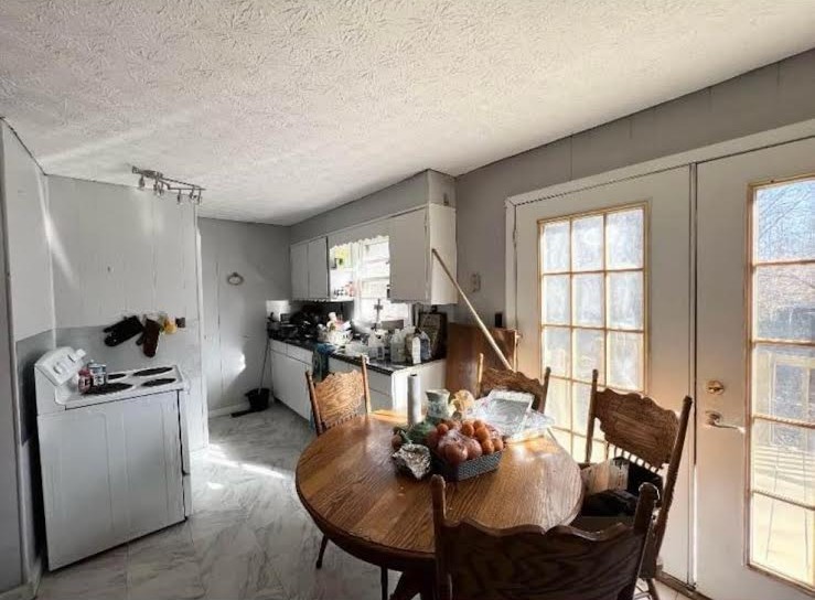 2058 Jefferson Road Smithville, TN 37166 - Photo 6 of 10 a living room with furniture a large window and a chandelier