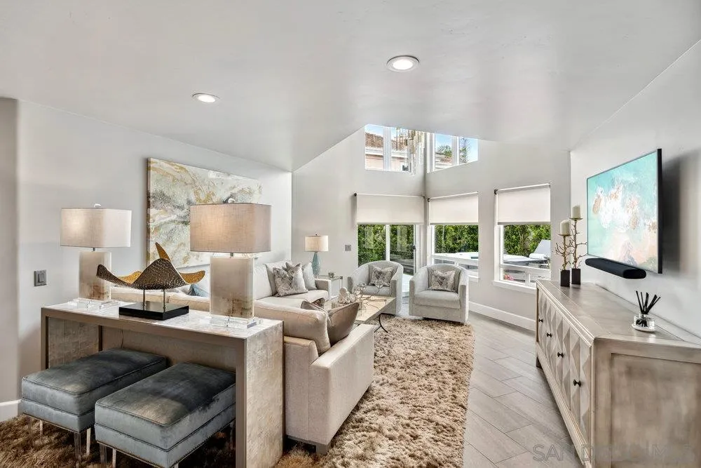 12 Mardi Gras Road Coronado, CA 92118 - Photo 17 of 70 a living room with furniture large window and a flat screen tv