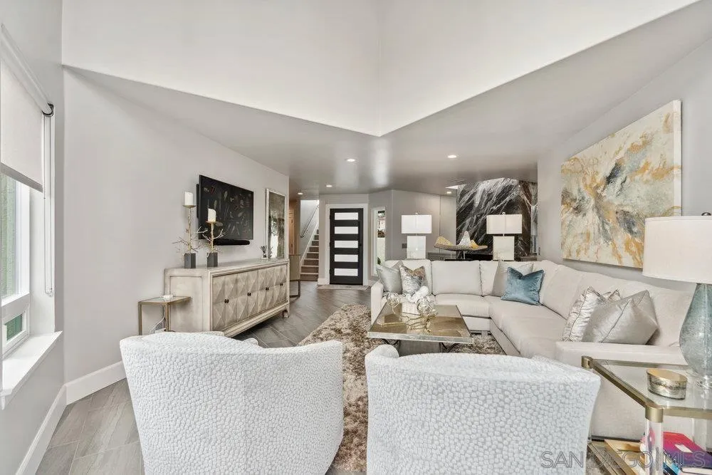 12 Mardi Gras Road Coronado, CA 92118 - Photo 21 of 70 a living room with furniture a flat screen tv and kitchen view