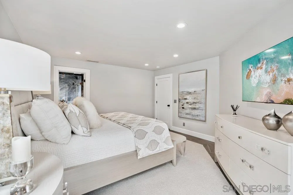 12 Mardi Gras Road Coronado, CA 92118 - Photo 26 of 70 a bedroom with a bed and a flat screen tv