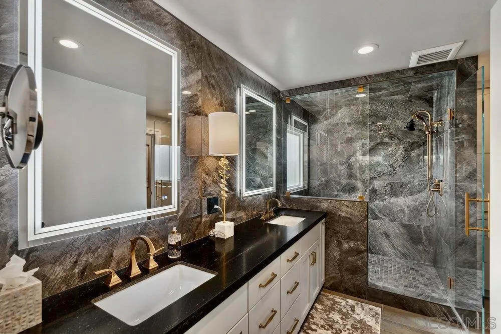 12 Mardi Gras Road Coronado, CA 92118 - Photo 27 of 70 a bathroom with a double vanity sink mirror and shower