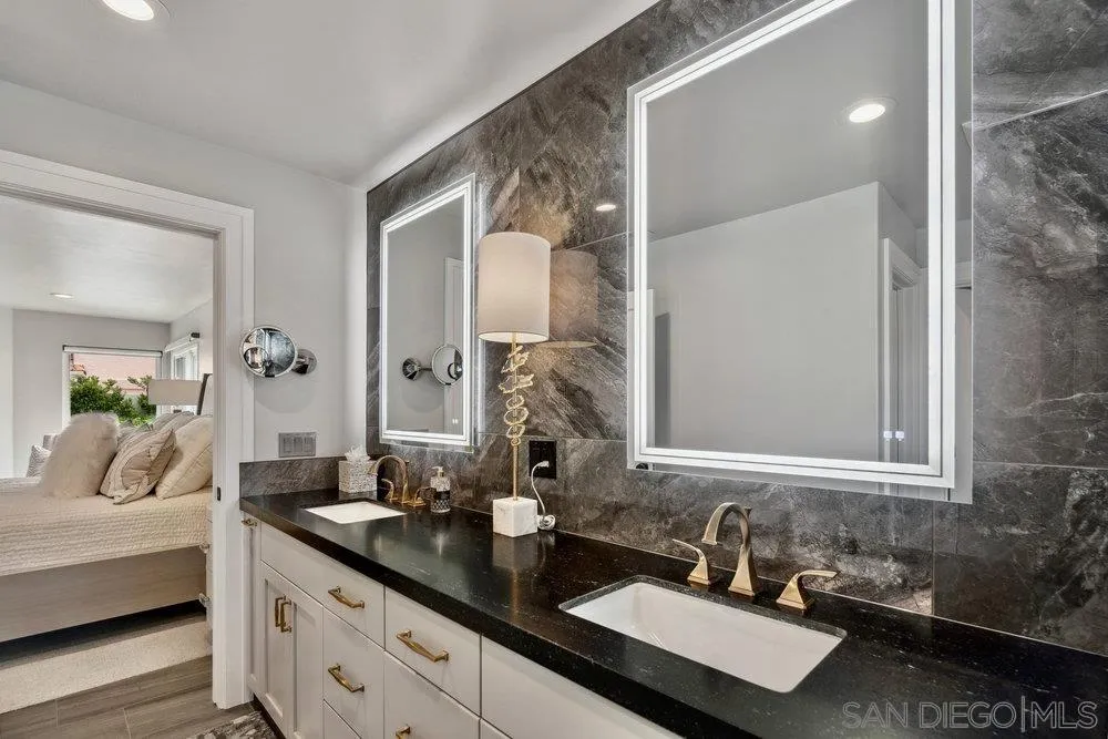 12 Mardi Gras Road Coronado, CA 92118 - Photo 28 of 70 a en suite bathroom with double sink and a mirror