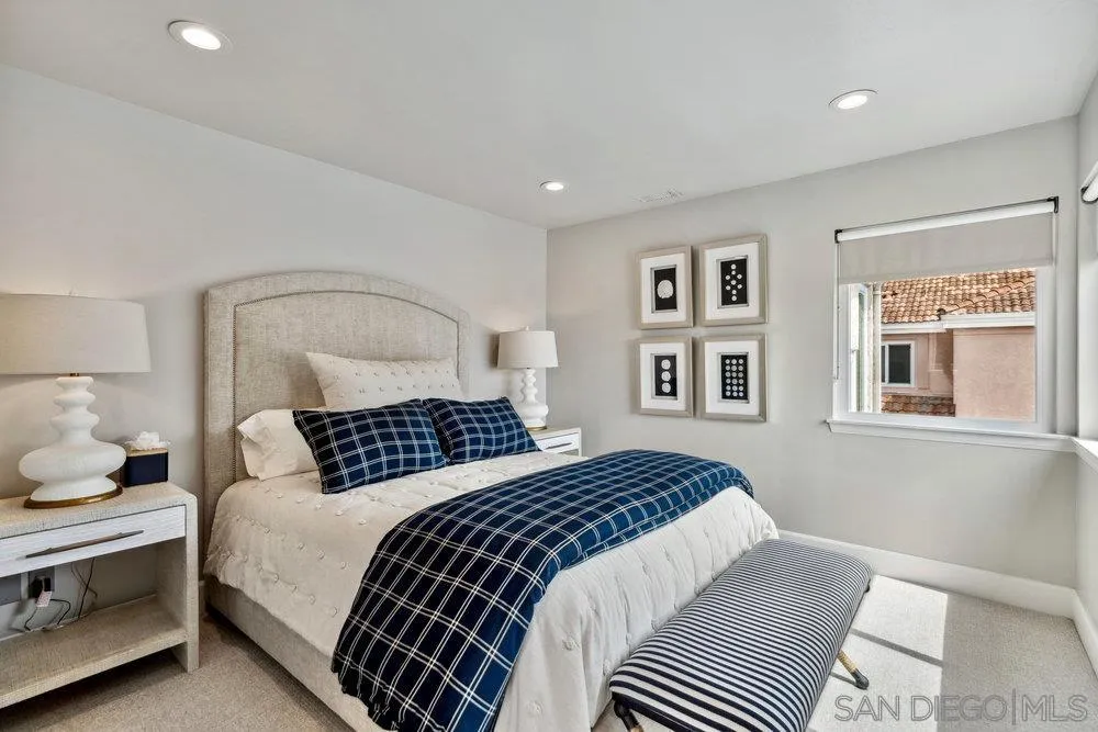 12 Mardi Gras Road Coronado, CA 92118 - Photo 33 of 70 a bedroom with a large bed and a window