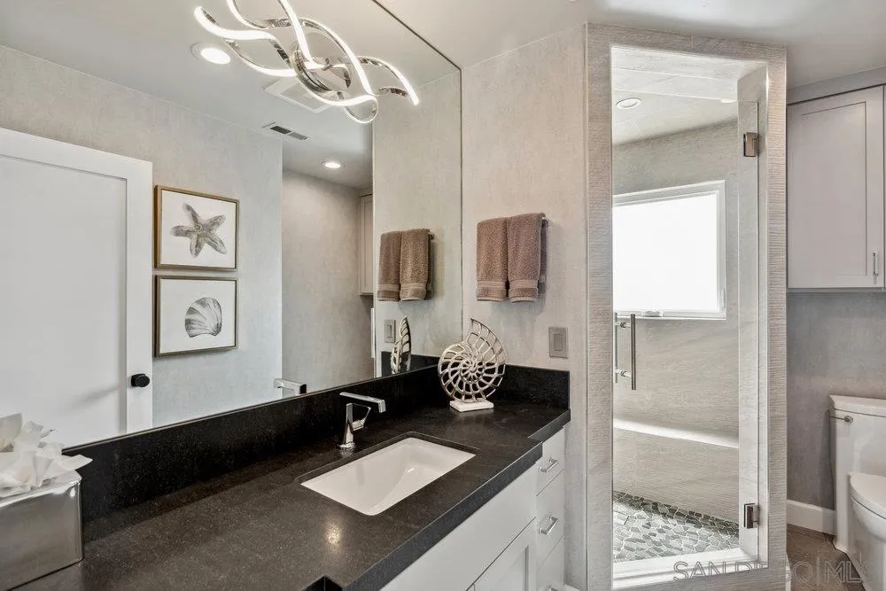 12 Mardi Gras Road Coronado, CA 92118 - Photo 35 of 70 a bathroom with a double vanity sink and a mirror