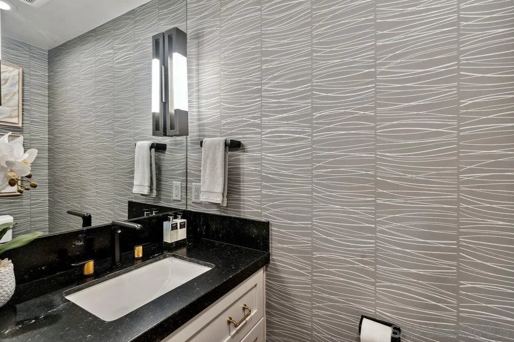 12 Mardi Gras Road Coronado, CA 92118 - Photo 37 of 70 a bathroom with a sink and a mirror