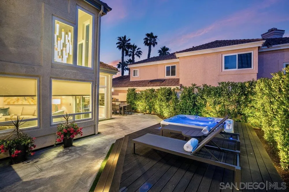 12 Mardi Gras Road Coronado, CA 92118 - Photo 50 of 70 a view of a deck with table and chairs potted plants with wooden floor