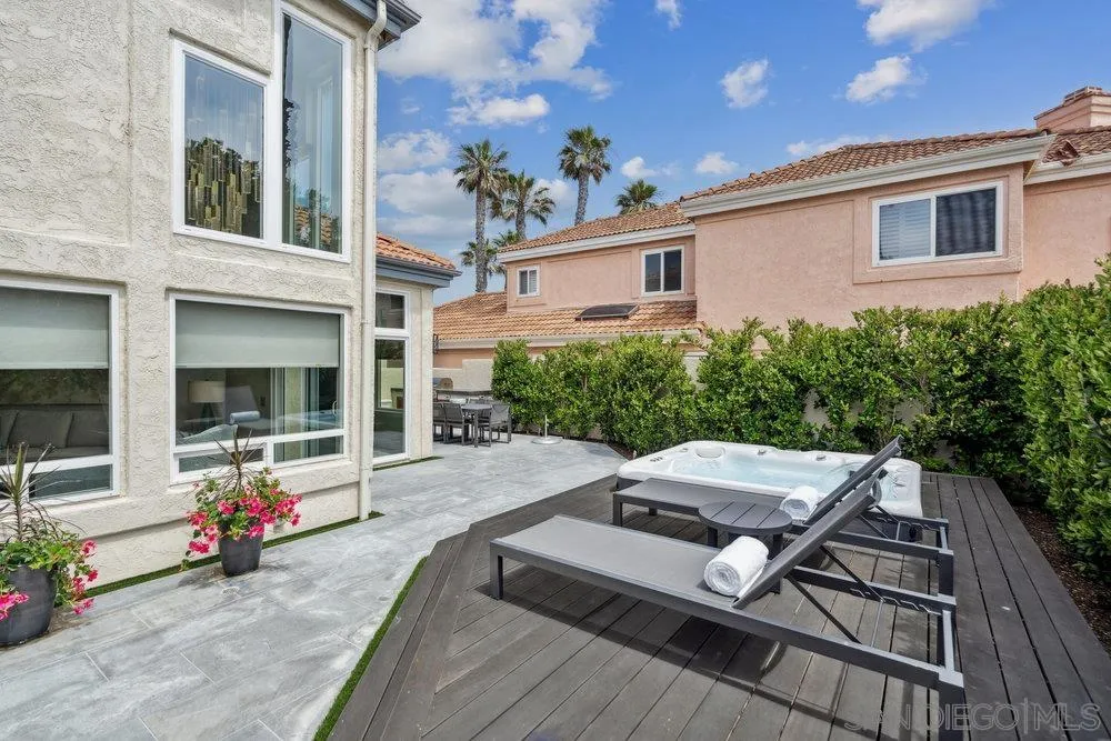 12 Mardi Gras Road Coronado, CA 92118 - Photo 52 of 70 a view of a patio with couches table and chairs with wooden floor and fence