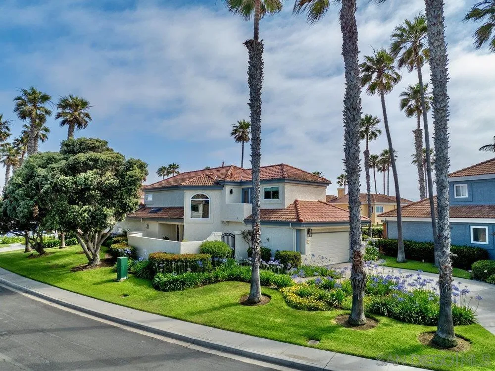 12 Mardi Gras Road Coronado, CA 92118 - Photo 62 of 70 a front view of a house with a garden