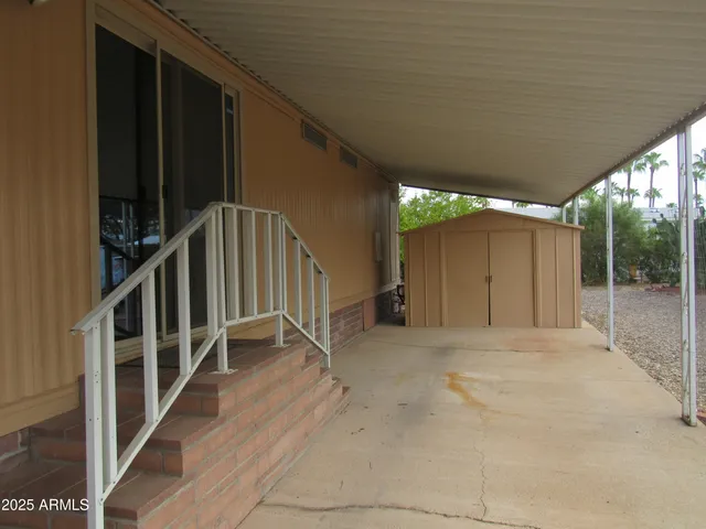 a view of entryway with wooden floor and a yard