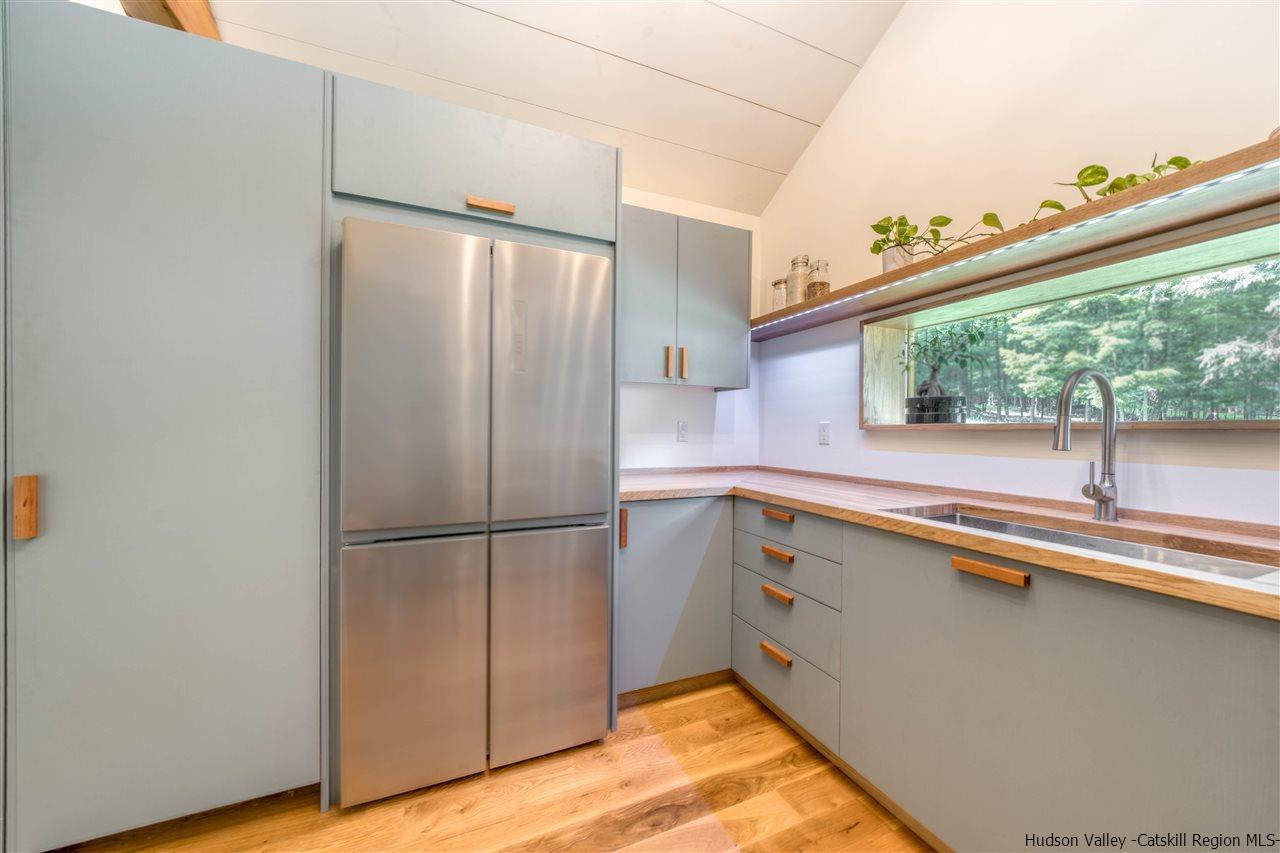 317 Sheldon Hill Road Olivebridge, NY 12461 - Photo 12 of 23 a kitchen with a refrigerator and window