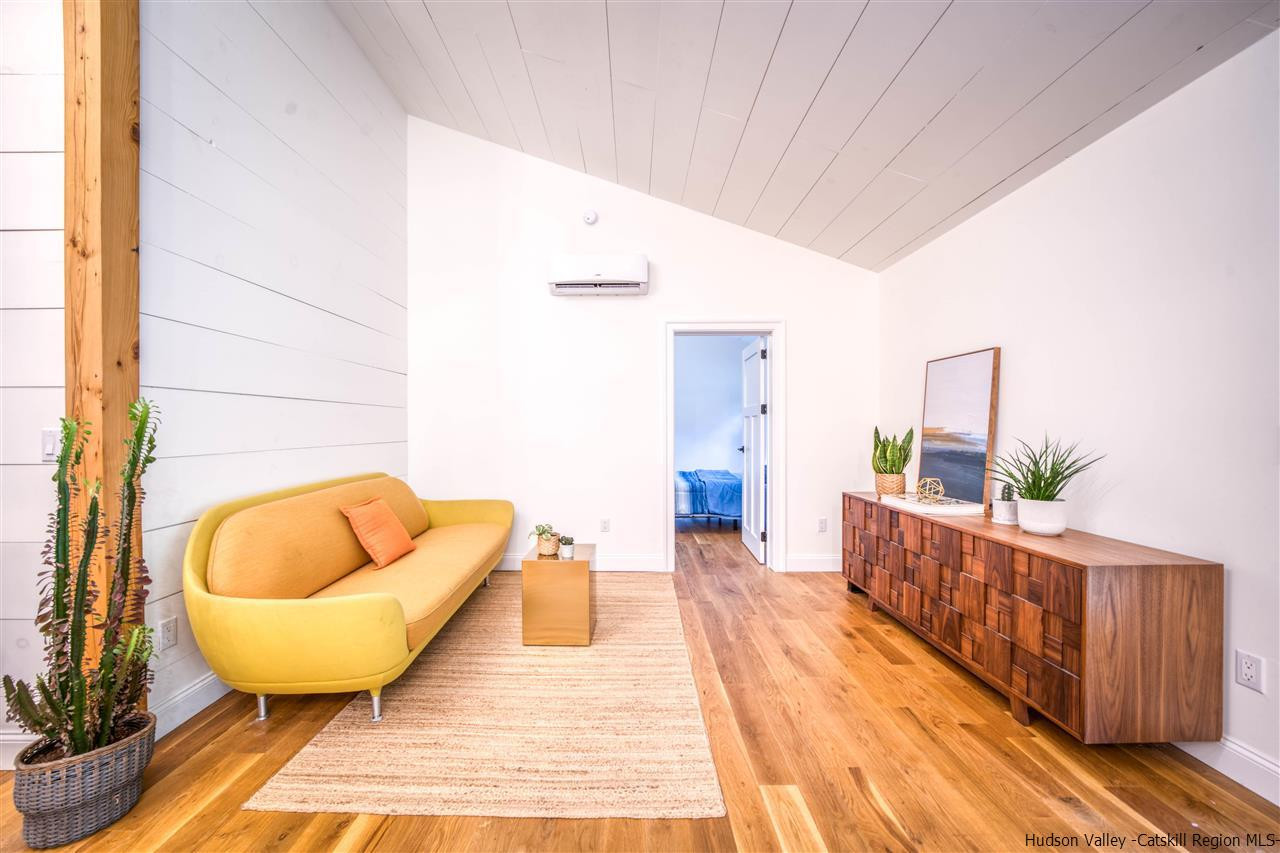 317 Sheldon Hill Road Olivebridge, NY 12461 - Photo 6 of 23 a living room with a rug and a wooden floor