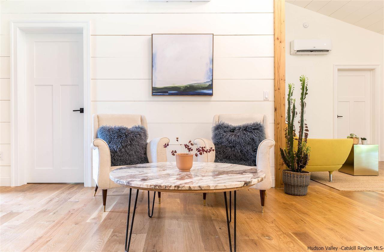 317 Sheldon Hill Road Olivebridge, NY 12461 - Photo 7 of 23 a view of a dining room with furniture and wooden floor