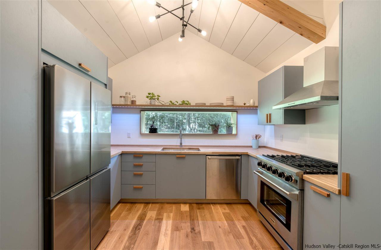 317 Sheldon Hill Road Olivebridge, NY 12461 - Photo 10 of 23 a kitchen with stainless steel appliances granite countertop a sink a stove and refrigerator
