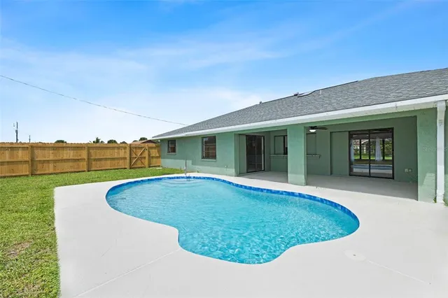 a view of a house with a swimming pool