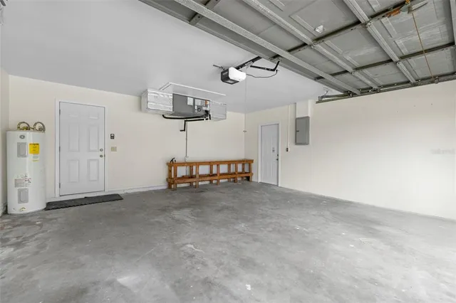 an aerial view of a house with swimming pool garden and tall buildings