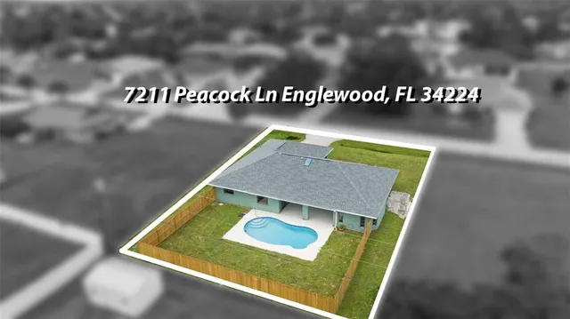 an aerial view of a house with swimming pool garden and outdoor seating