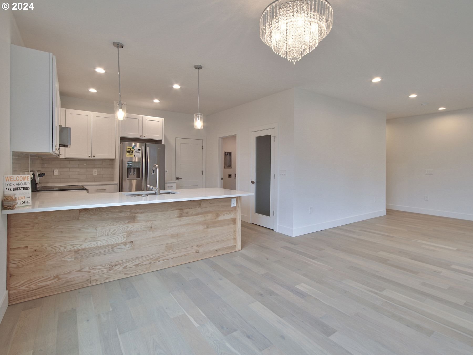 365 Northeast Oakview Drive Estacada, OR 97023 - Photo 11 of 39 a large kitchen with stainless steel appliances a large counter top a sink a refrigerator and a granite counter tops