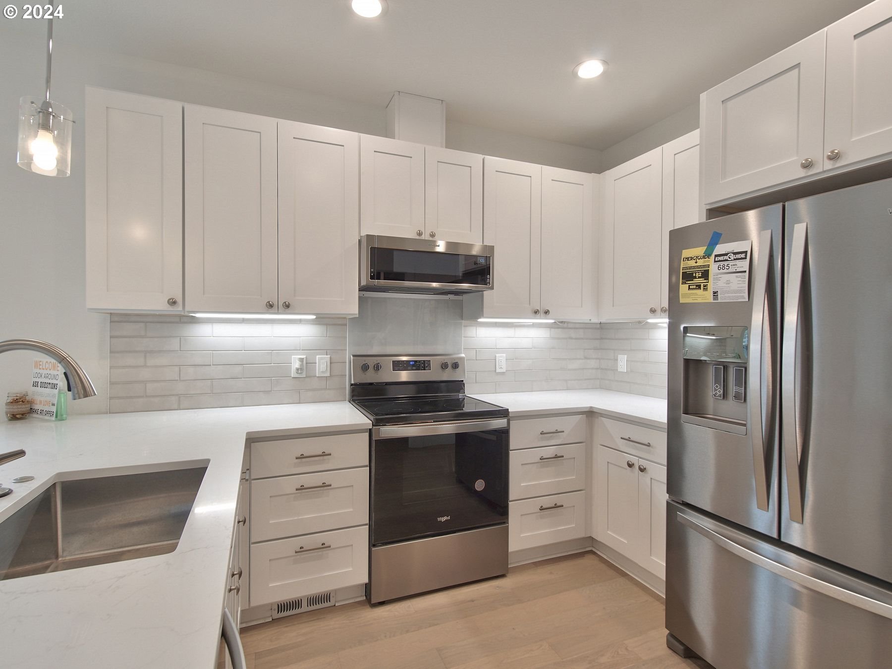 365 Northeast Oakview Drive Estacada, OR 97023 - Photo 13 of 39 a kitchen with white cabinets and stainless steel appliances