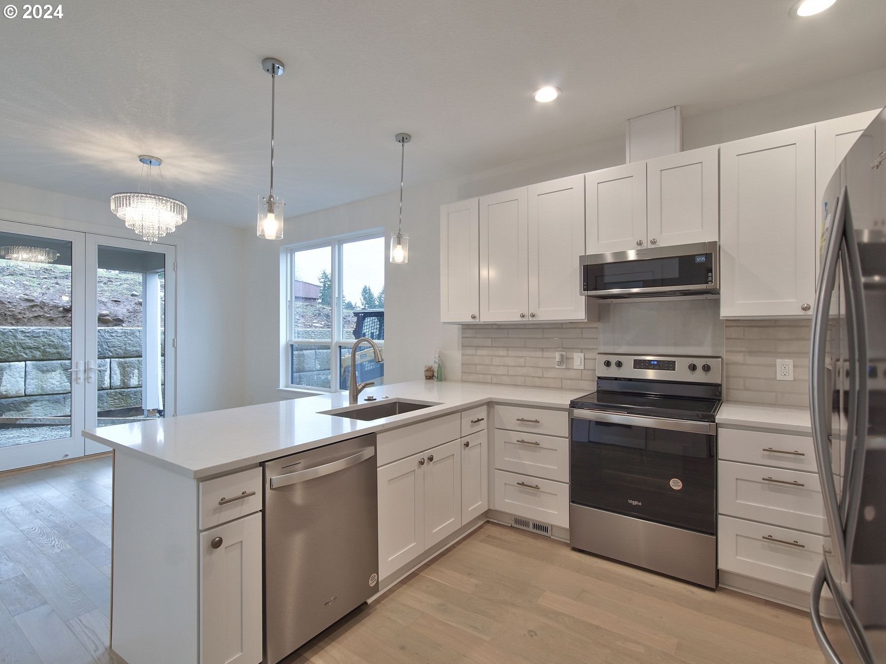365 Northeast Oakview Drive Estacada, OR 97023 - Photo 15 of 39 a kitchen with a sink stove and cabinets