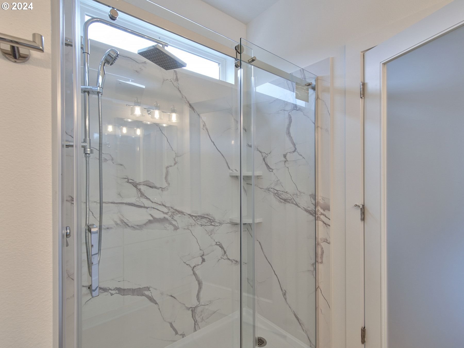 365 Northeast Oakview Drive Estacada, OR 97023 - Photo 23 of 39 a bathroom with a glass shower door
