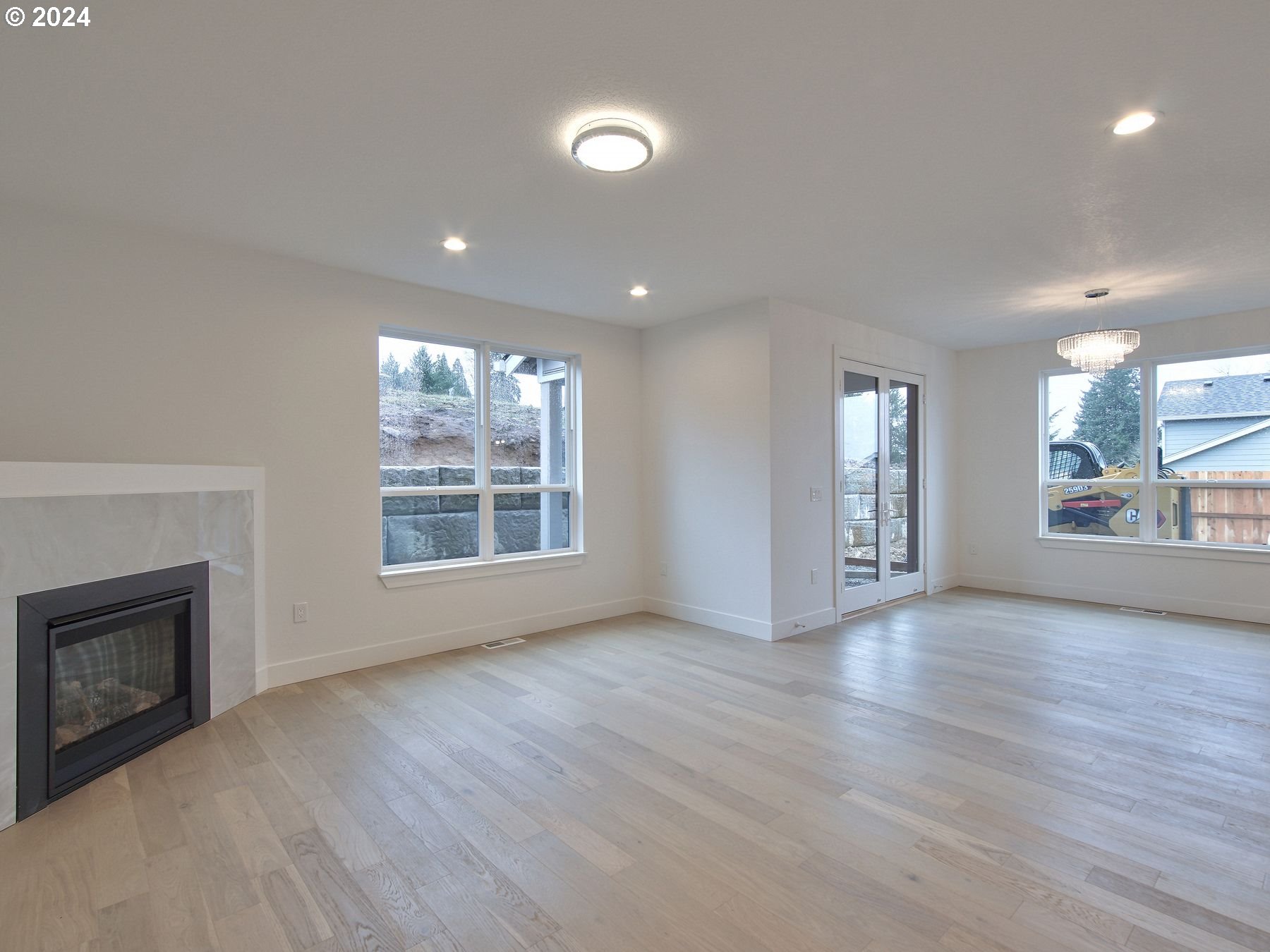 365 Northeast Oakview Drive Estacada, OR 97023 - Photo 6 of 39 a view of an empty room with a window and wooden floor