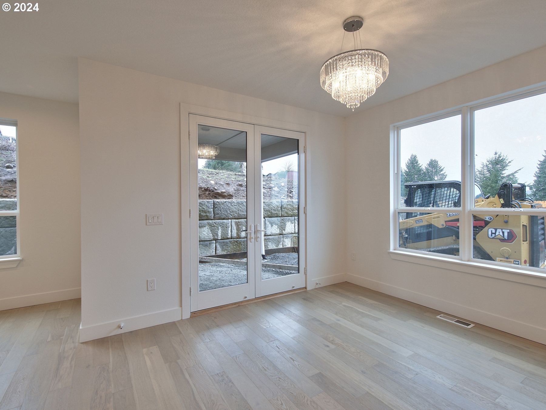 365 Northeast Oakview Drive Estacada, OR 97023 - Photo 9 of 39 an empty room with wooden floor and windows