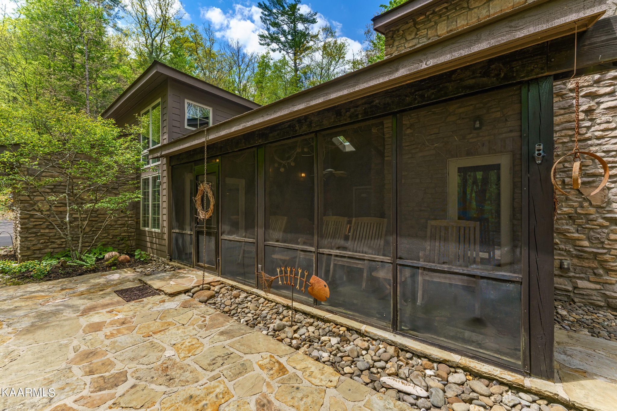 4614 Whetstone Road Sevierville, TN 37862 - Photo 56 of 60 a backyard of a house with table and chairs
