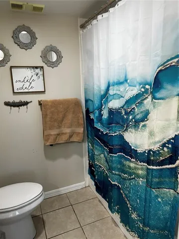 a bathroom with a toilet and a sink