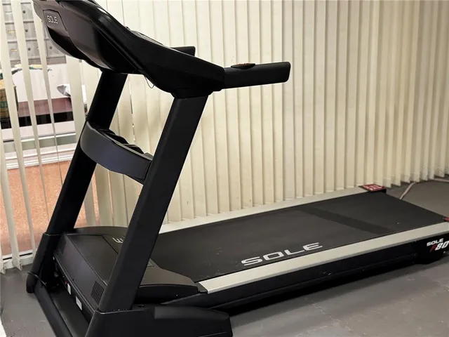 a view of pool with table and chairs