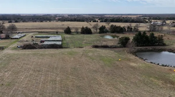 an aerial view of a house with a garden