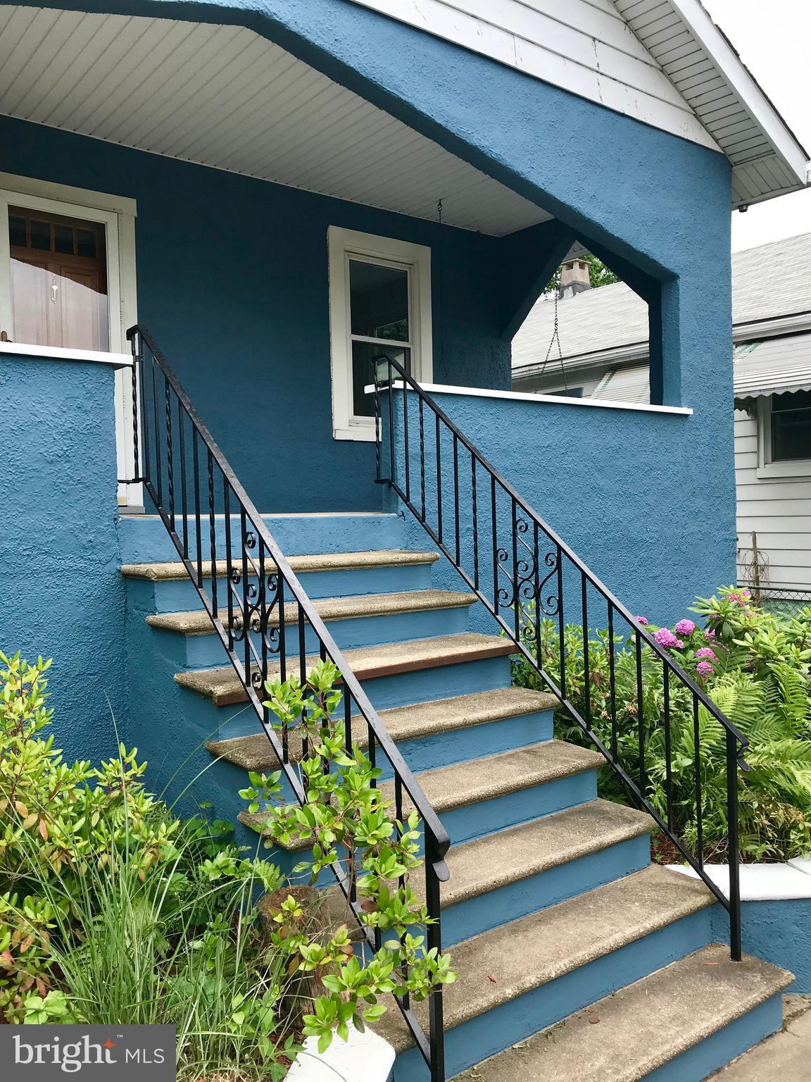 6907 Ridgeway Road Baltimore, MD 21222 - Photo 4 of 25 a view of stairs and flowers