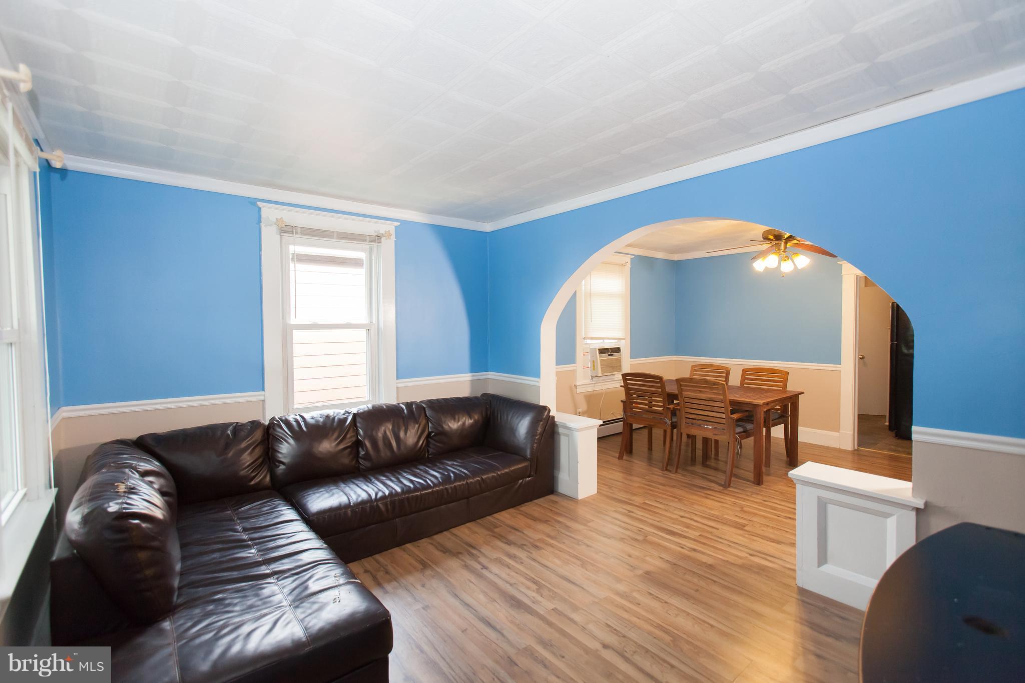 6907 Ridgeway Road Baltimore, MD 21222 - Photo 7 of 25 a living room with furniture and wooden floor