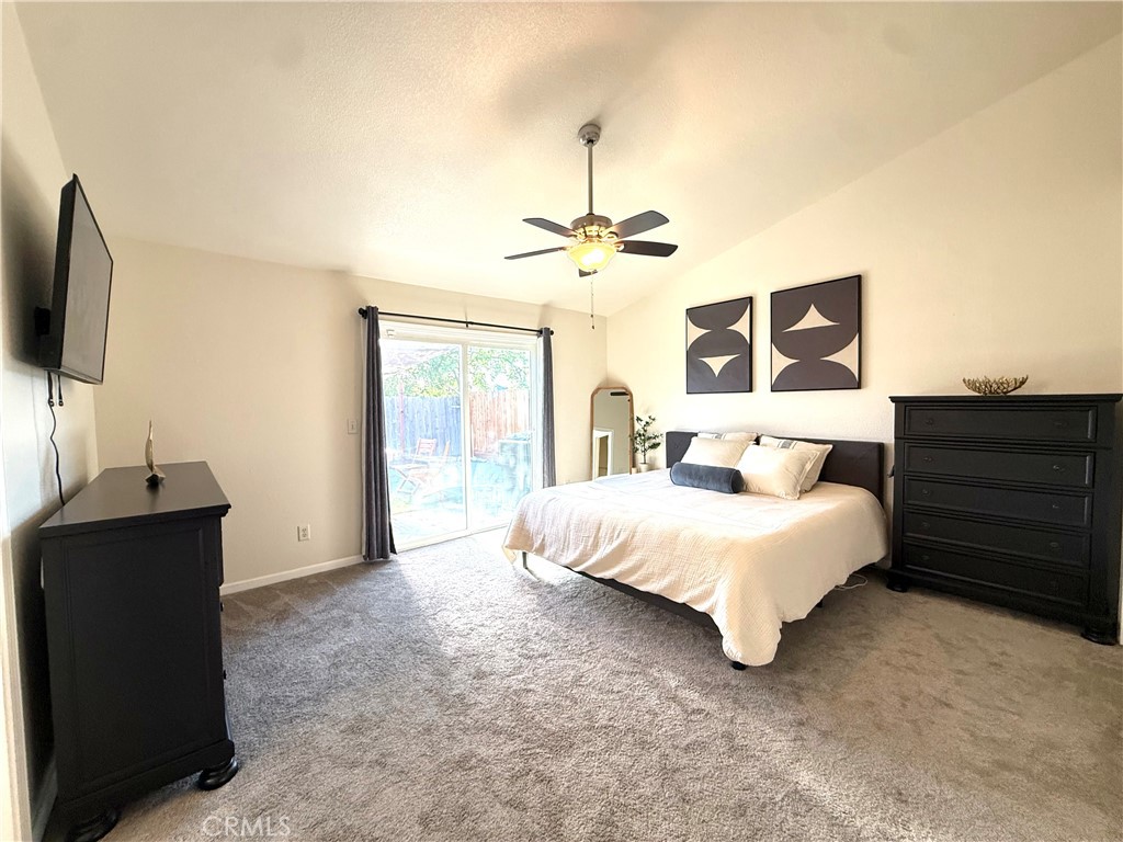 2709 Big Sandy Avenue Merced, CA 95348 - Photo 29 of 51 a spacious bedroom with a bed and a flat screen tv