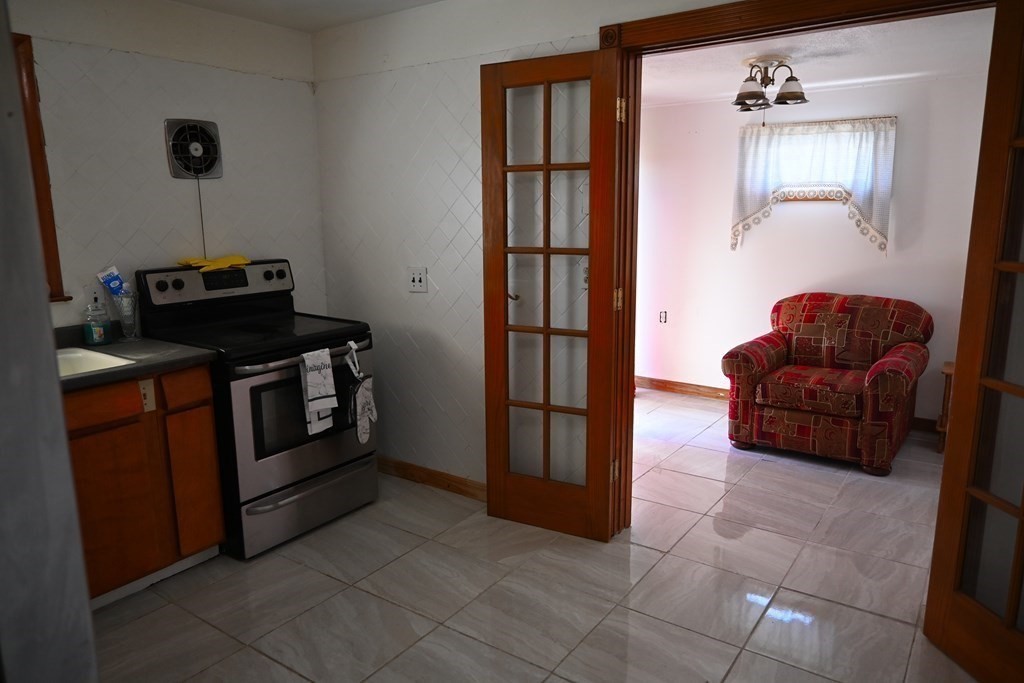 16 Charles Hill Road Holyoke, MA 01040 - Photo 13 of 27 a living room with furniture and a flat screen tv